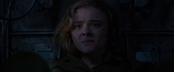 Movie still from “Shadow in the Cloud” (2020), directed by Roseanne Liang – A person with blood on their face; Close Up shot, High angle