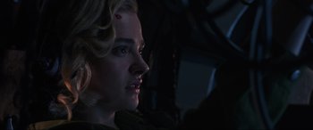 Movie still from “Shadow in the Cloud” (2020), directed by Roseanne Liang – A person in a dark room; Close Up shot, Low angle