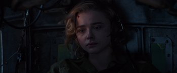 Movie still from “Shadow in the Cloud” (2020), directed by Roseanne Liang – A woman with a bandage on her face; Close Up shot, High angle