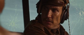 Movie still from “Shadow in the Cloud” (2020), directed by Roseanne Liang – A person wearing a helmet; Close Up shot, Low angle