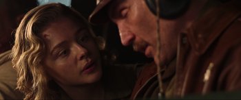 Movie still from “Shadow in the Cloud” (2020), directed by Roseanne Liang – A man and a woman looking at one another; Close Up shot, Over the shoulder angle