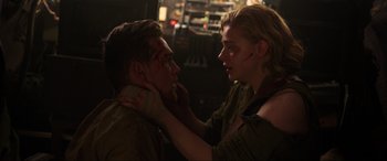 Movie still from “Shadow in the Cloud” (2020), directed by Roseanne Liang – A man and a woman with bandages on their faces; Close Up shot, Over the shoulder angle