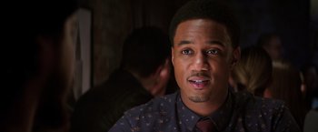 Movie still from “Shaft” (2019), directed by Tim Story – A person wearing a shirt and a tie; Close Up shot, Over the shoulder angle