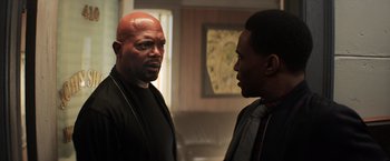 Movie still from “Shaft” (2019), directed by Tim Story – Two men standing next to each other in a room; Close Up shot, Over the shoulder angle