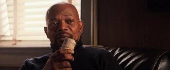 Movie still from “Shaft” (2019), directed by Tim Story – An older man holding a brush in his mouth; Close Up shot, Low angle