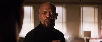 Movie still from “Shaft” (2019), directed by Tim Story – A man with a beard and a black sweater; Close Up shot, Low angle