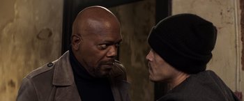 Movie still from “Shaft” (2019), directed by Tim Story – A man and a woman face to face in a dark room; Close Up shot, Over the shoulder angle