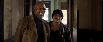 Movie still from “Shaft” (2019), directed by Tim Story – Two men standing next to each other in a room; Medium shot, Low angle