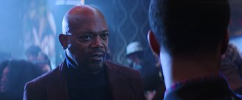 Movie still from “Shaft” (2019), directed by Tim Story – A man in a red jacket talking to another man in a black jacket; Close Up shot, Over the shoulder angle