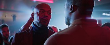 Movie still from “Shaft” (2019), directed by Tim Story – Two men are talking in a dark room; Close Up shot, Over the shoulder angle