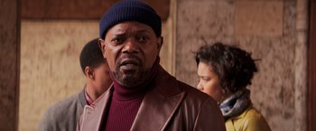 Movie still from “Shaft” (2019), directed by Tim Story – A man in a brown jacket and a blue hat; Close Up shot, Over the shoulder angle