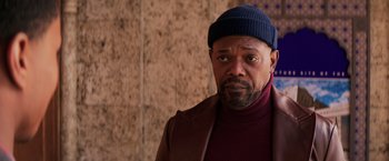 Movie still from “Shaft” (2019), directed by Tim Story – A person wearing a jacket and a hat; Close Up shot, Low angle
