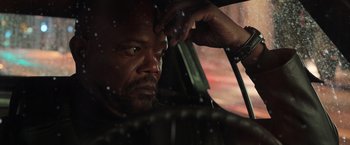 Movie still from “Shaft” (2019), directed by Tim Story – A person sitting in a car; Close Up shot, Low angle