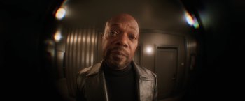 Movie still from “Shaft” (2019), directed by Tim Story – A person wearing a leather jacket; Close Up shot, High angle