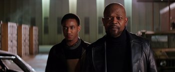 Movie still from “Shaft” (2019), directed by Tim Story – Two men standing next to each other in front of a building; Close Up shot, Low angle
