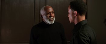 Movie still from “Shaft” (2019), directed by Tim Story – Two men talking to each other in front of a wall; Close Up shot, Over the shoulder angle