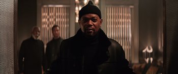 Movie still from “Shaft” (2019), directed by Tim Story – A man wearing a black jacket and a hat; Medium shot, Low angle