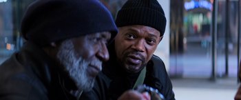 Movie still from “Shaft” (2019), directed by Tim Story – Two men sitting next to each other in a room; Close Up shot, Over the shoulder angle