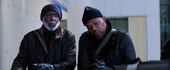 Movie still from “Shaft” (2019), directed by Tim Story – Two older black men sitting next to each other; Medium shot, Low angle