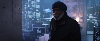 Movie still from “Shaft” (2019), directed by Tim Story – An older man wearing a black hat and a black jacket; Medium shot, Low angle