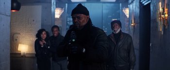 Movie still from “Shaft” (2019), directed by Tim Story – A group of men standing next to each other holding guns; Medium shot, Low angle