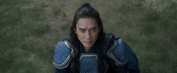 Movie still from “Shang-Chi and the Legend of the Ten Rings” (2021), directed by Destin Daniel Cretton – A person wearing armor; Close Up shot, Low angle