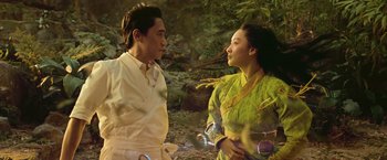 Movie still from “Shang-Chi and the Legend of the Ten Rings” (2021), directed by Destin Daniel Cretton – A man and a woman standing next to each other; Medium shot, Low angle