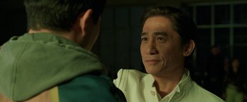 Movie still from “Shang-Chi and the Legend of the Ten Rings” (2021), directed by Destin Daniel Cretton – A person looking at another person; Close Up shot, Over the shoulder angle