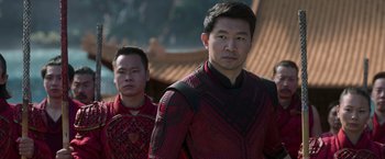 Movie still from “Shang-Chi and the Legend of the Ten Rings” (2021), directed by Destin Daniel Cretton – Two asian men standing next to each other; Medium shot, Over the shoulder angle