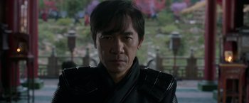 Movie still from “Shang-Chi and the Legend of the Ten Rings” (2021), directed by Destin Daniel Cretton – A person wearing a leather jacket; Close Up shot, Over the shoulder angle