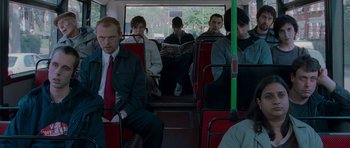 Movie still from “Shaun of the Dead” (2004), directed by Edgar Wright – A group of people riding on a bus; Medium shot, Over the shoulder angle