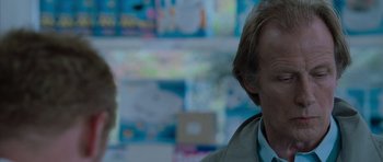 Movie still from “Shaun of the Dead” (2004), directed by Edgar Wright – A person wearing a jacket; Close Up shot, Over the shoulder angle