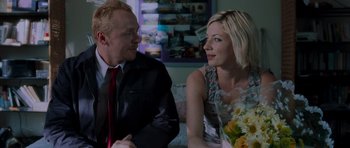 Movie still from “Shaun of the Dead” (2004), directed by Edgar Wright – A man and a woman sitting at a dinner table; Close Up shot, Over the shoulder angle