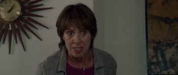 Movie still from “Shaun of the Dead” (2004), directed by Edgar Wright – A person wearing a jacket; Close Up shot, Over the shoulder angle