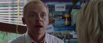 Movie still from “Shaun of the Dead” (2004), directed by Edgar Wright – A person in a white shirt; Close Up shot, Over the shoulder angle