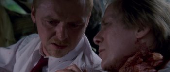 Movie still from “Shaun of the Dead” (2004), directed by Edgar Wright – A man and a woman looking into each other's eyes; Close Up shot, Over the shoulder angle