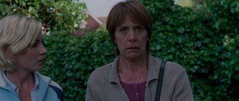 Movie still from “Shaun of the Dead” (2004), directed by Edgar Wright – A person wearing a jacket; Close Up shot, Over the shoulder angle