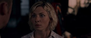 Movie still from “Shaun of the Dead” (2004), directed by Edgar Wright – A person with short blonde hair; Close Up shot, Over the shoulder angle