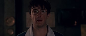 Movie still from “Shaun of the Dead” (2004), directed by Edgar Wright – A person wearing glasses; Close Up shot, Over the shoulder angle
