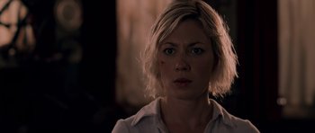 Movie still from “Shaun of the Dead” (2004), directed by Edgar Wright – A person with short blonde hair; Close Up shot, Over the shoulder angle