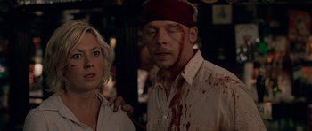 Movie still from “Shaun of the Dead” (2004), directed by Edgar Wright – A man and a woman with blood all over their face; Close Up shot, Over the shoulder angle