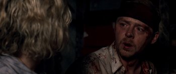 Movie still from “Shaun of the Dead” (2004), directed by Edgar Wright – A man and a woman in a room with blood all over them; Close Up shot, Over the shoulder angle