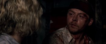Movie still from “Shaun of the Dead” (2004), directed by Edgar Wright – A person with a hat on; Close Up shot, Over the shoulder angle