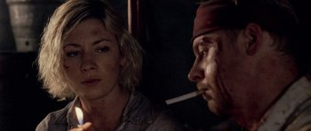 Movie still from “Shaun of the Dead” (2004), directed by Edgar Wright – A man and a woman are smoking a cigarette together; Close Up shot, Over the shoulder angle