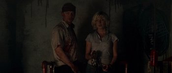 Movie still from “Shaun of the Dead” (2004), directed by Edgar Wright – A man and a woman standing next to each other; Medium shot, Low angle