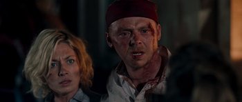 Movie still from “Shaun of the Dead” (2004), directed by Edgar Wright – A man and a woman with blood all over their face; Close Up shot, Over the shoulder angle