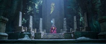 Movie still from “Shazam!” (2019), directed by David F. Sandberg – A person sitting on steps holding an object in their hand; Extreme Wide shot, Low angle