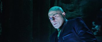 Movie still from “Shazam!” (2019), directed by David F. Sandberg – A man with bald head looking at the camera; Close Up shot, Low angle