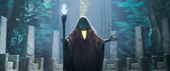 Movie still from “Shazam!” (2019), directed by David F. Sandberg – An image of an old man holding a magic staff; Medium shot, Low angle