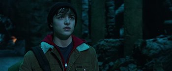 Movie still from “Shazam!” (2019), directed by David F. Sandberg – A young man wearing a brown jacket and a black hat; Close Up shot, Low angle